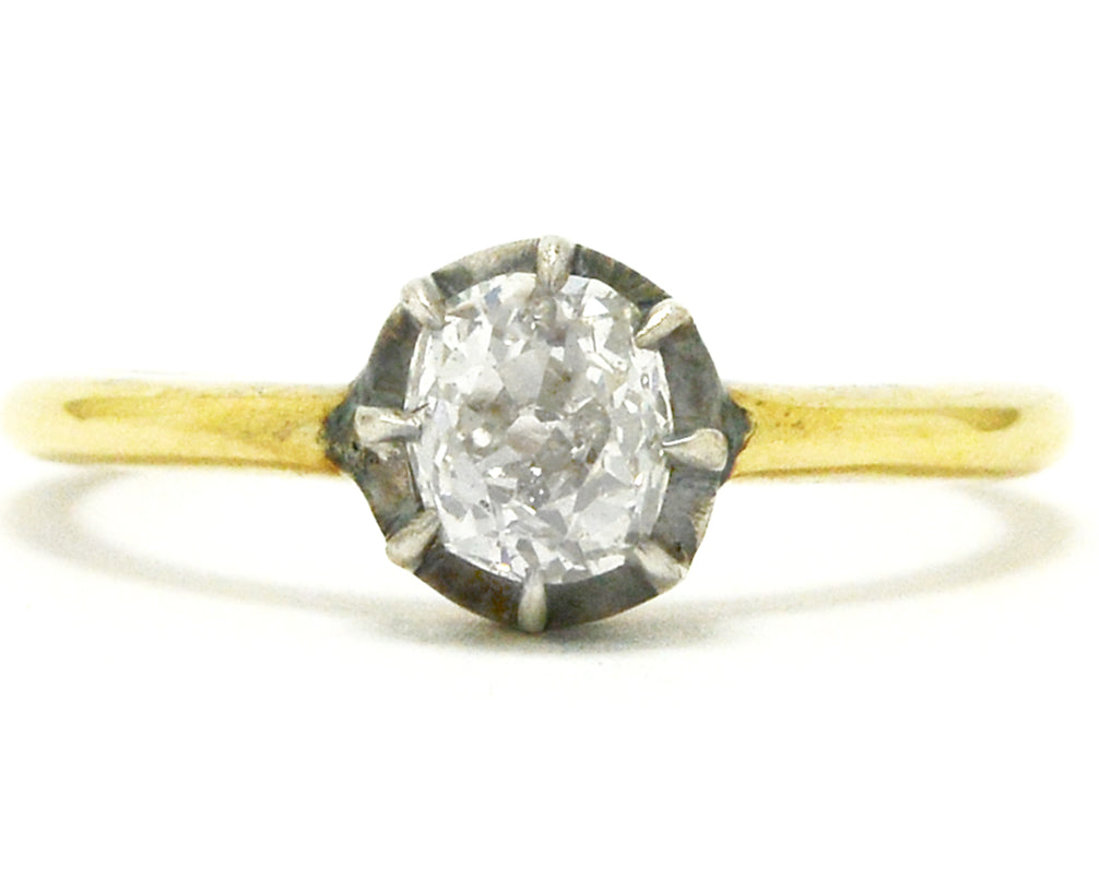 A silver and yellow gold Georgian style diamond solitaire ring.