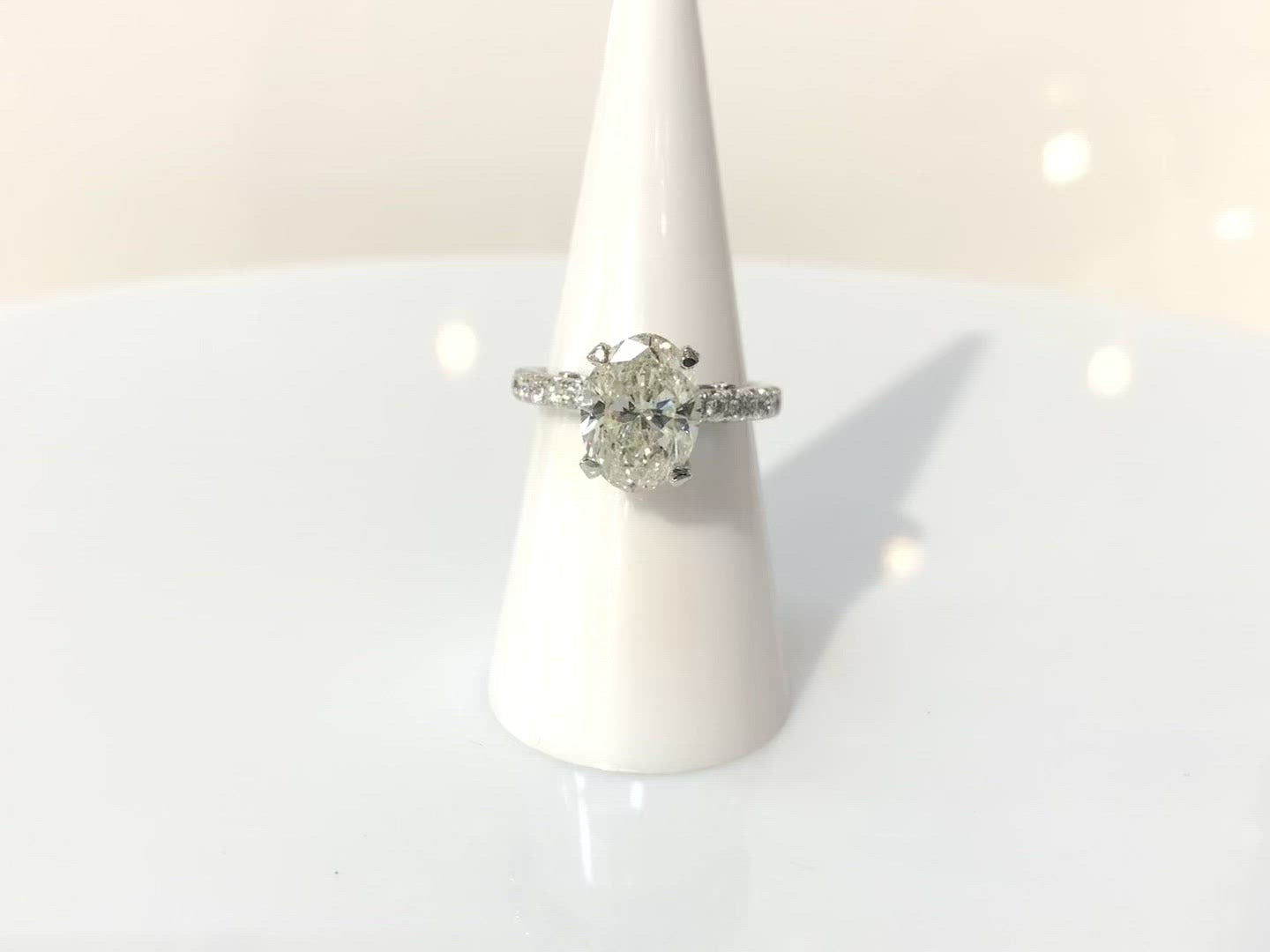 A three carat oval brilliant cut diamond wedding ring.
