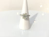 A three carat oval brilliant cut diamond wedding ring.